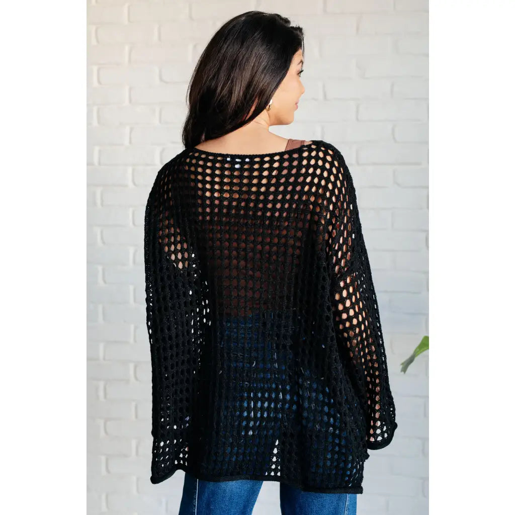 Reel in some serious style with our Ask Anyway Fishnet Sweater. Its boat neckline dropped shoulder side slits and black
