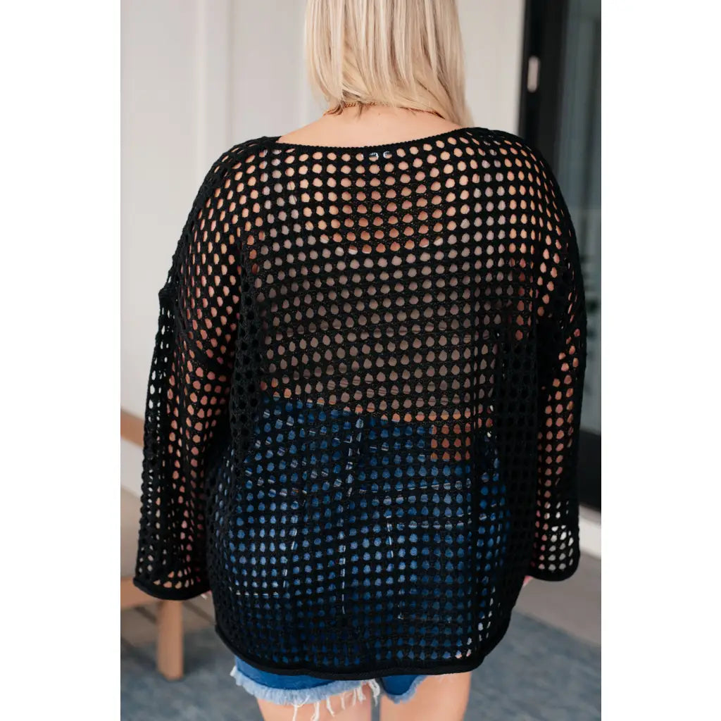 Reel in some serious style with our Ask Anyway Fishnet Sweater. Its boat neckline dropped shoulder side slits and black