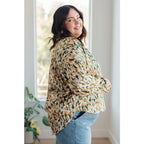 Satin button up blouse with amber and olive abstract print. Lightweight flowy fit that’s plus size office friendly.