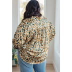 Satin button up blouse with amber and olive abstract print. Lightweight flowy fit that’s plus size office friendly.