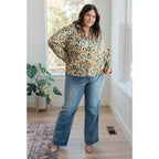 Satin button up blouse with amber and olive abstract print. Lightweight flowy fit that’s plus size office friendly.