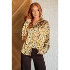 Satin button up blouse with amber and olive abstract print. Lightweight flowy fit that’s plus size office friendly.