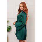 Our Back Atcha Green Mini Dress features a banded mock neckline and bell sleeves this poly satin A-line dress exudes