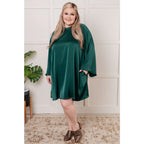 Our Back Atcha Green Mini Dress features a banded mock neckline and bell sleeves this poly satin A-line dress exudes