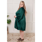Our Back Atcha Green Mini Dress features a banded mock neckline and bell sleeves this poly satin A-line dress exudes