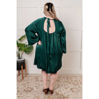 Our Back Atcha Green Mini Dress features a banded mock neckline and bell sleeves this poly satin A-line dress exudes