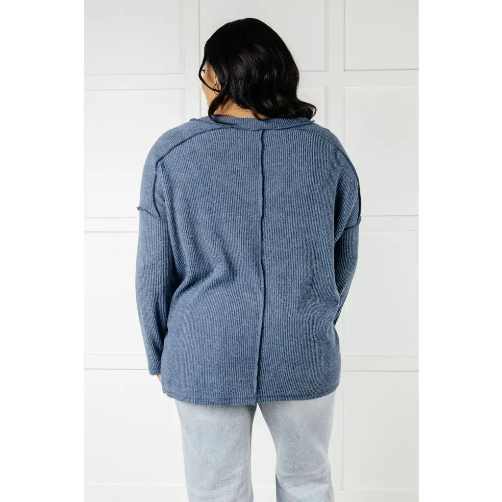 Get ready to cuddle up in our Basically Freezing V-Neck Top Dusty Blue! Its soft brushed hacci fabric and stretchy