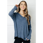 Get ready to cuddle up in our Basically Freezing V-Neck Top Dusty Blue! Its soft brushed hacci fabric and stretchy
