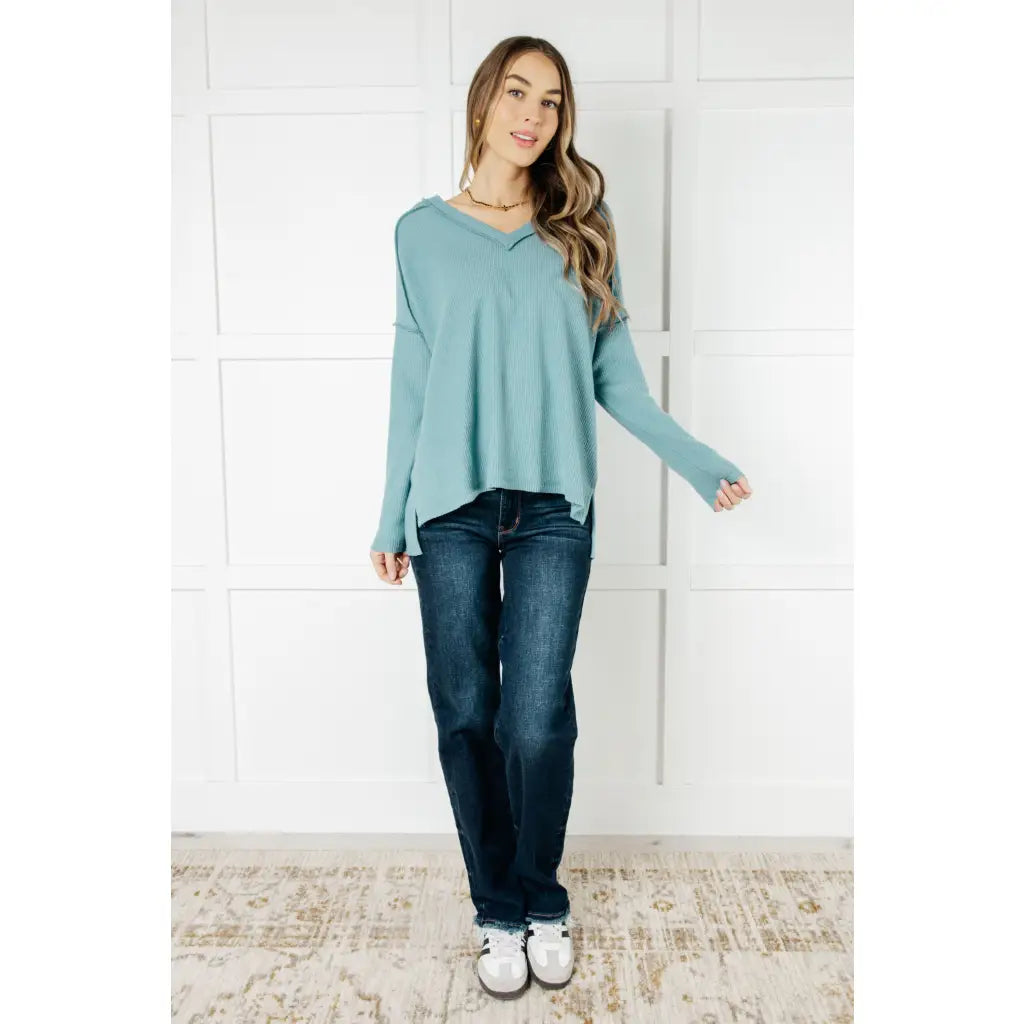 Get ready to cuddle up in our Basically Freezing V-Neck Top Dusty Teal! Its soft brushed hacci fabric and stretchy