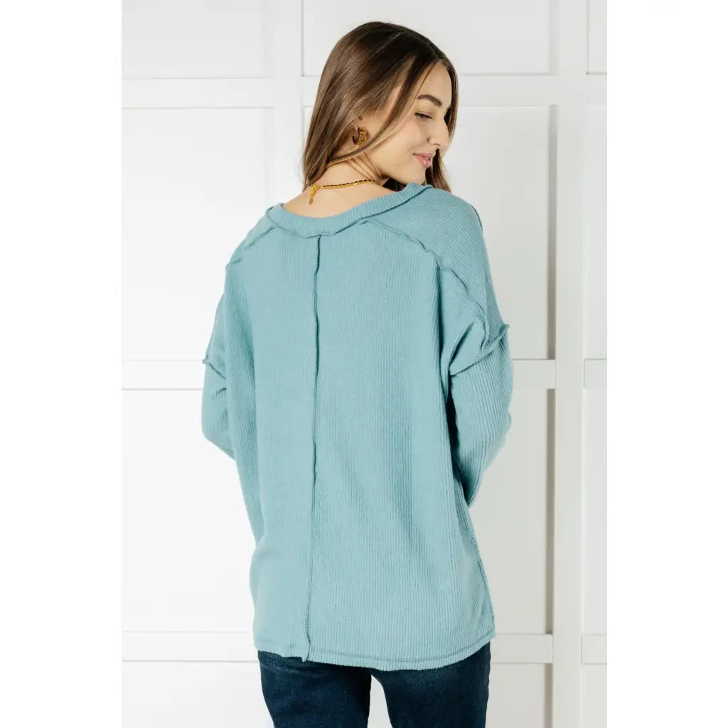 Get ready to cuddle up in our Basically Freezing V-Neck Top Dusty Teal! Its soft brushed hacci fabric and stretchy