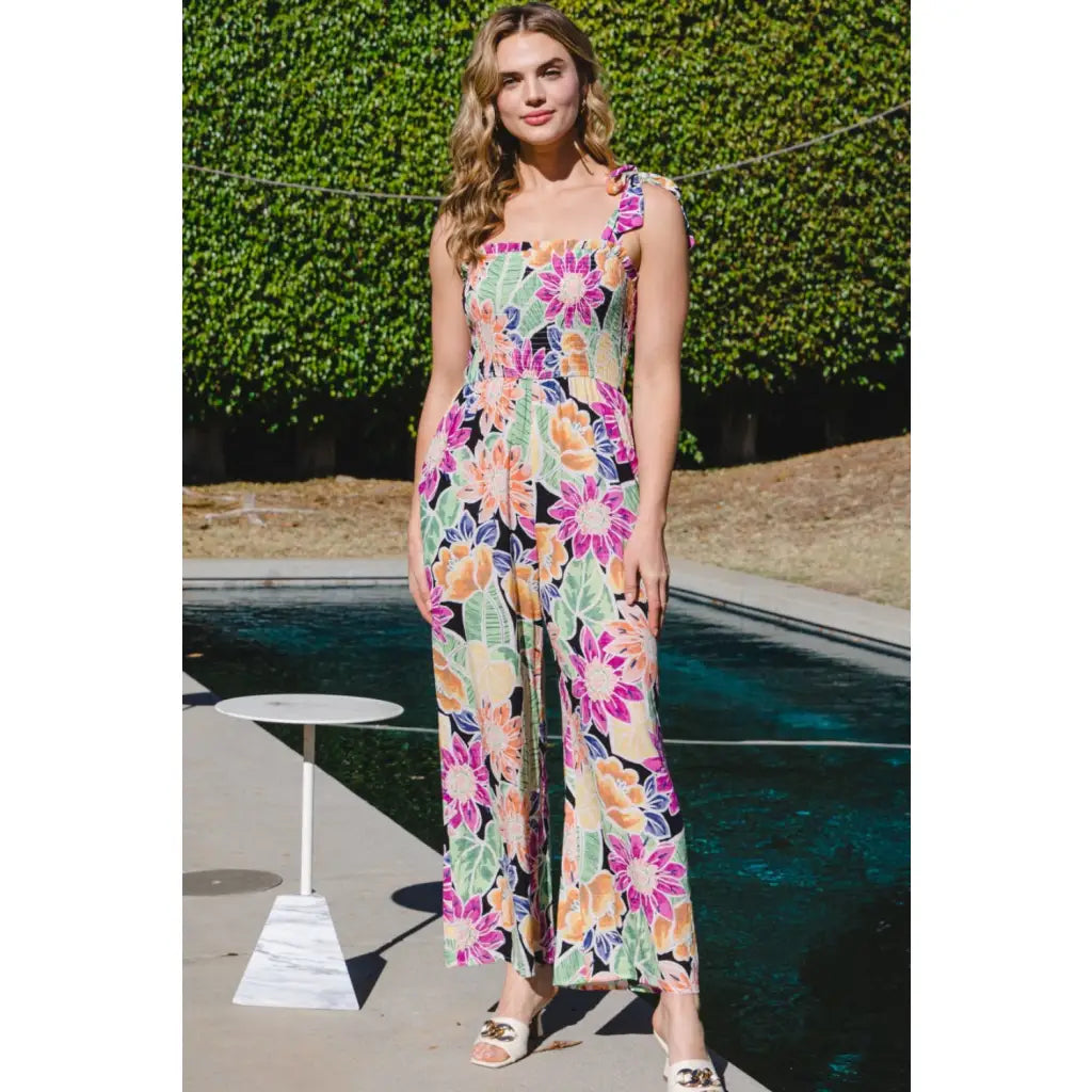 Our Be Bold Floral Wide Leg Jumpsuit is a fabulous and versatile piece that combines floral elegance with chic