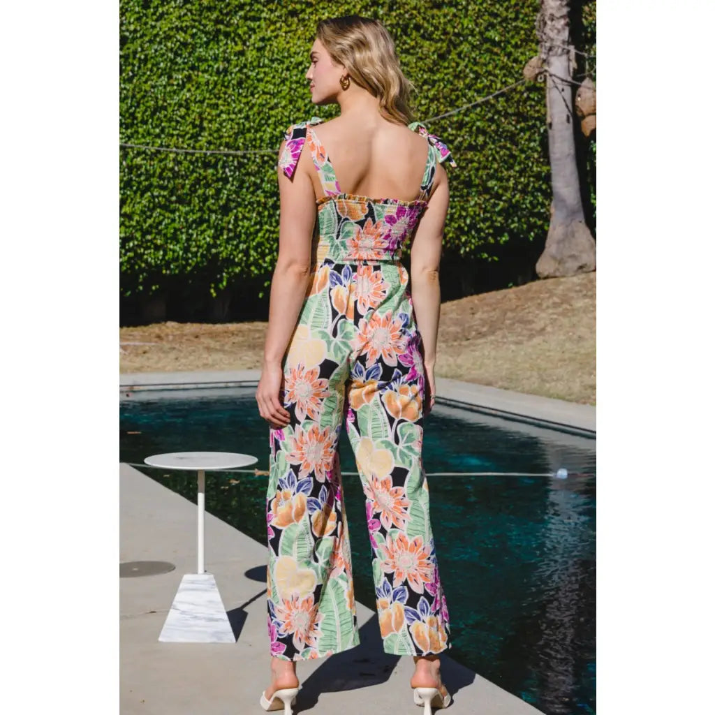 Our Be Bold Floral Wide Leg Jumpsuit is a fabulous and versatile piece that combines floral elegance with chic