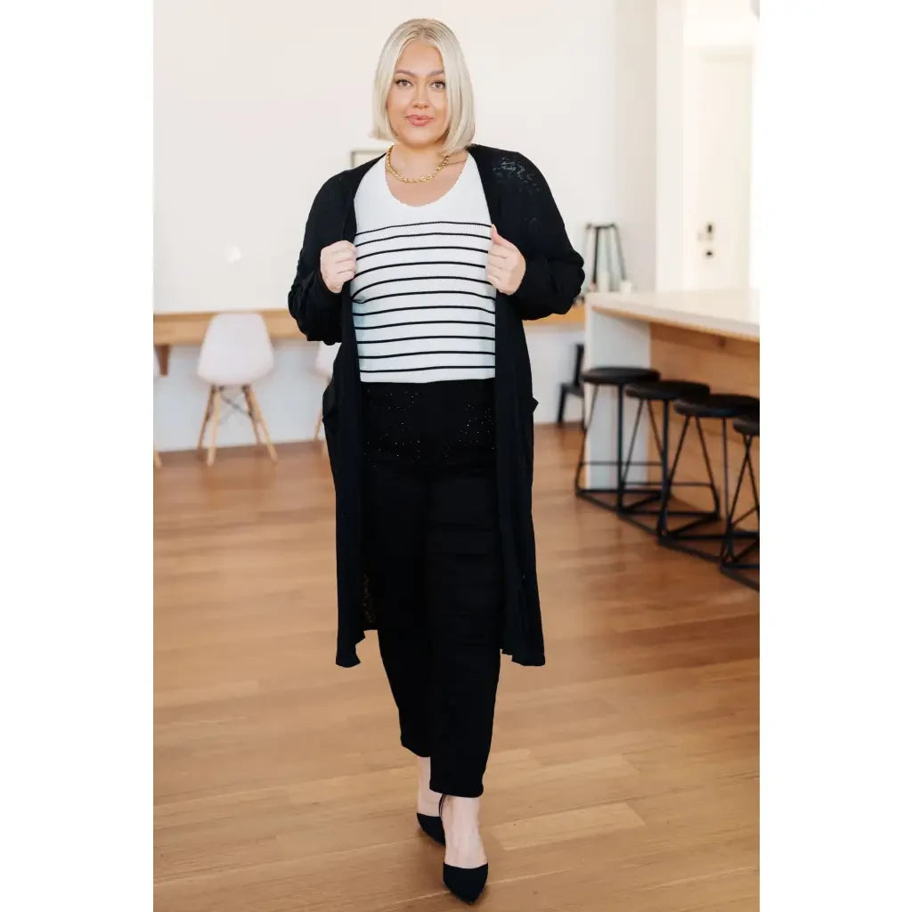 Our Be Still V-Neck Striped Sweater features a classic black and white stripe pattern that adds timeless versatile look