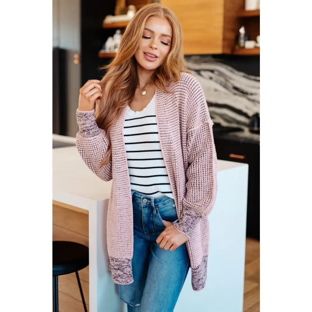 Our Be Still V-Neck Striped Sweater features a classic black and white stripe pattern that adds timeless versatile look