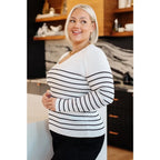 Our Be Still V-Neck Striped Sweater features a classic black and white stripe pattern that adds timeless versatile look