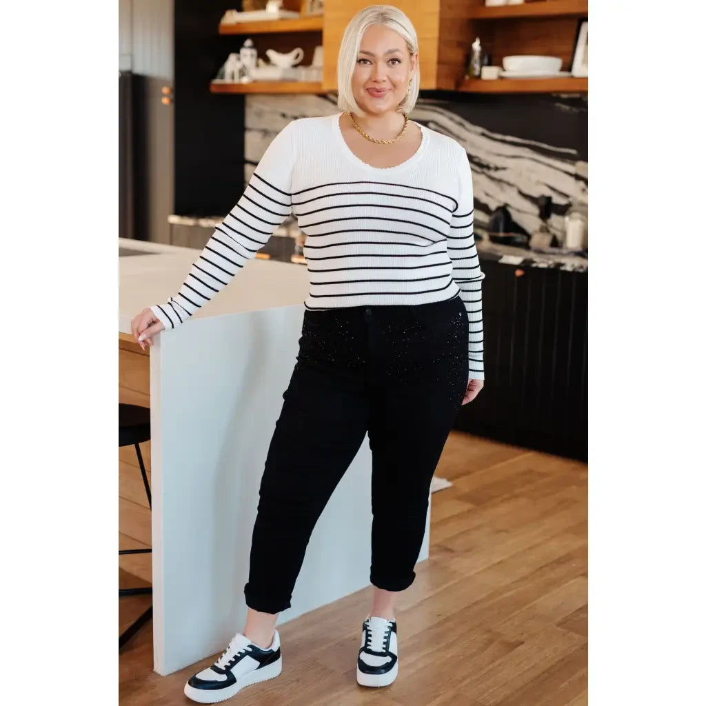 Our Be Still V-Neck Striped Sweater features a classic black and white stripe pattern that adds timeless versatile look