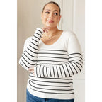 Our Be Still V-Neck Striped Sweater features a classic black and white stripe pattern that adds timeless versatile look