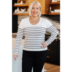 Our Be Still V-Neck Striped Sweater features a classic black and white stripe pattern that adds timeless versatile look