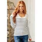 Our Be Still V-Neck Striped Sweater features a classic black and white stripe pattern that adds timeless versatile look