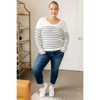 Our Be Still V-Neck Striped Sweater features a classic black and white stripe pattern that adds timeless versatile look