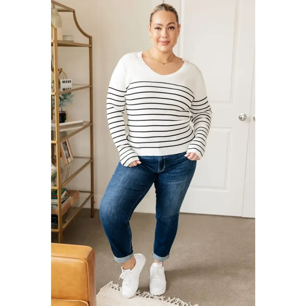 Our Be Still V-Neck Striped Sweater features a classic black and white stripe pattern that adds timeless versatile look