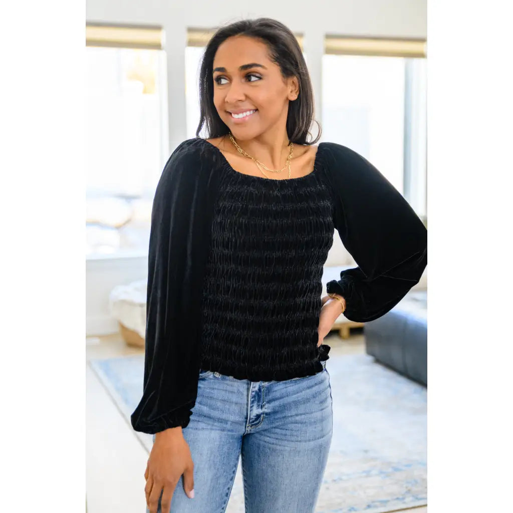 Our Believe In Miracles Smocked Velvet Top Black is an obvious choice for your next night out! Rich velvet shapes