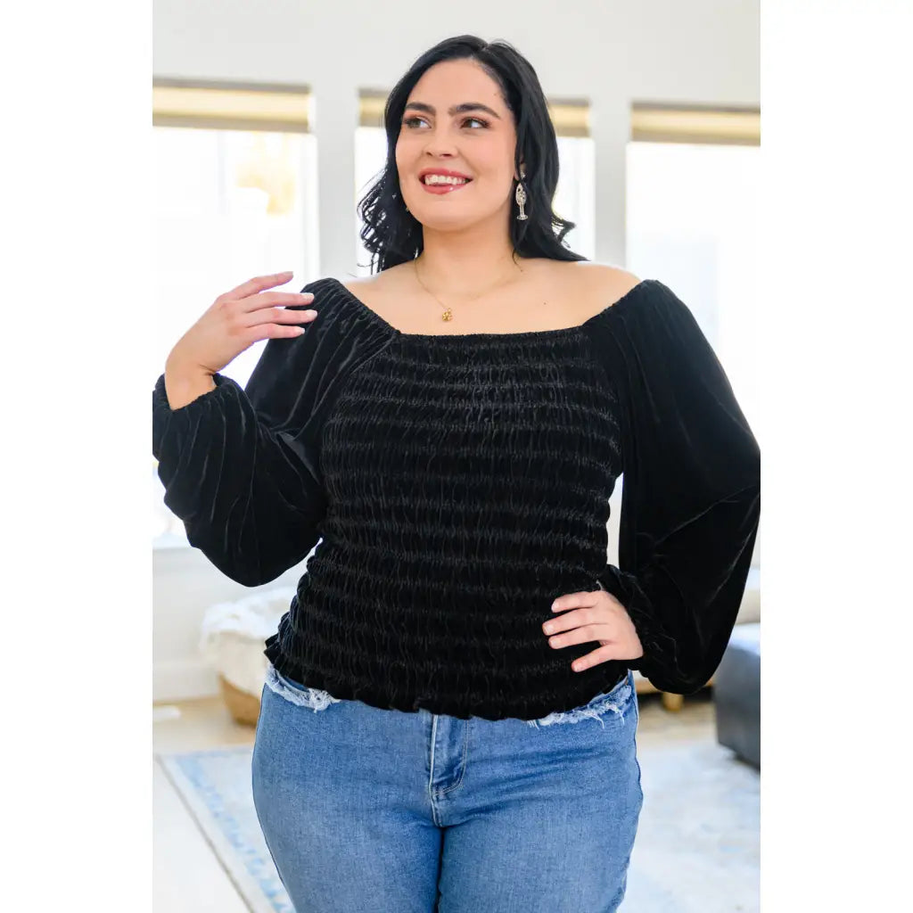 Our Believe In Miracles Smocked Velvet Top Black is an obvious choice for your next night out! Rich velvet shapes
