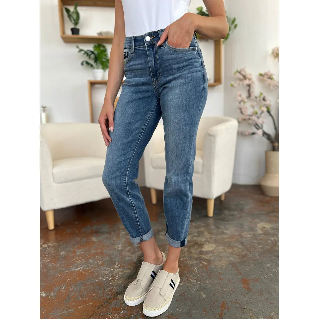 Elevate your denim game with our Best Eva Cuffed Hem Slim Fit Judy Blue Jeans. The cropped cuffed hem detail adds
