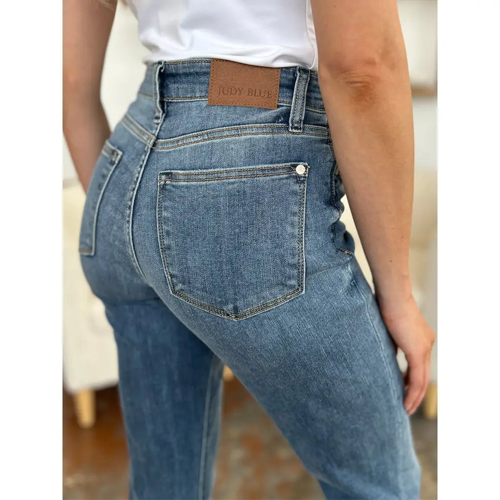 Elevate your denim game with our Best Eva Cuffed Hem Slim Fit Judy Blue Jeans. The cropped cuffed hem detail adds