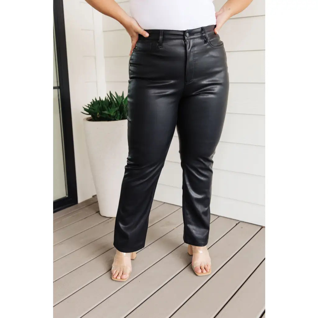 Break the rules with our Faux Black Leather Judy Blue Pants! These high-waisted pants feature tummy control tech