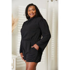 Our Black Open Back Romper with Pockets is the perfect combination of style and functionality. The high neck open back