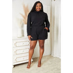 Our Black Open Back Romper with Pockets is the perfect combination of style and functionality. The high neck open back