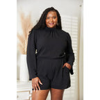 Our Black Open Back Romper with Pockets is the perfect combination of style and functionality. The high neck open back