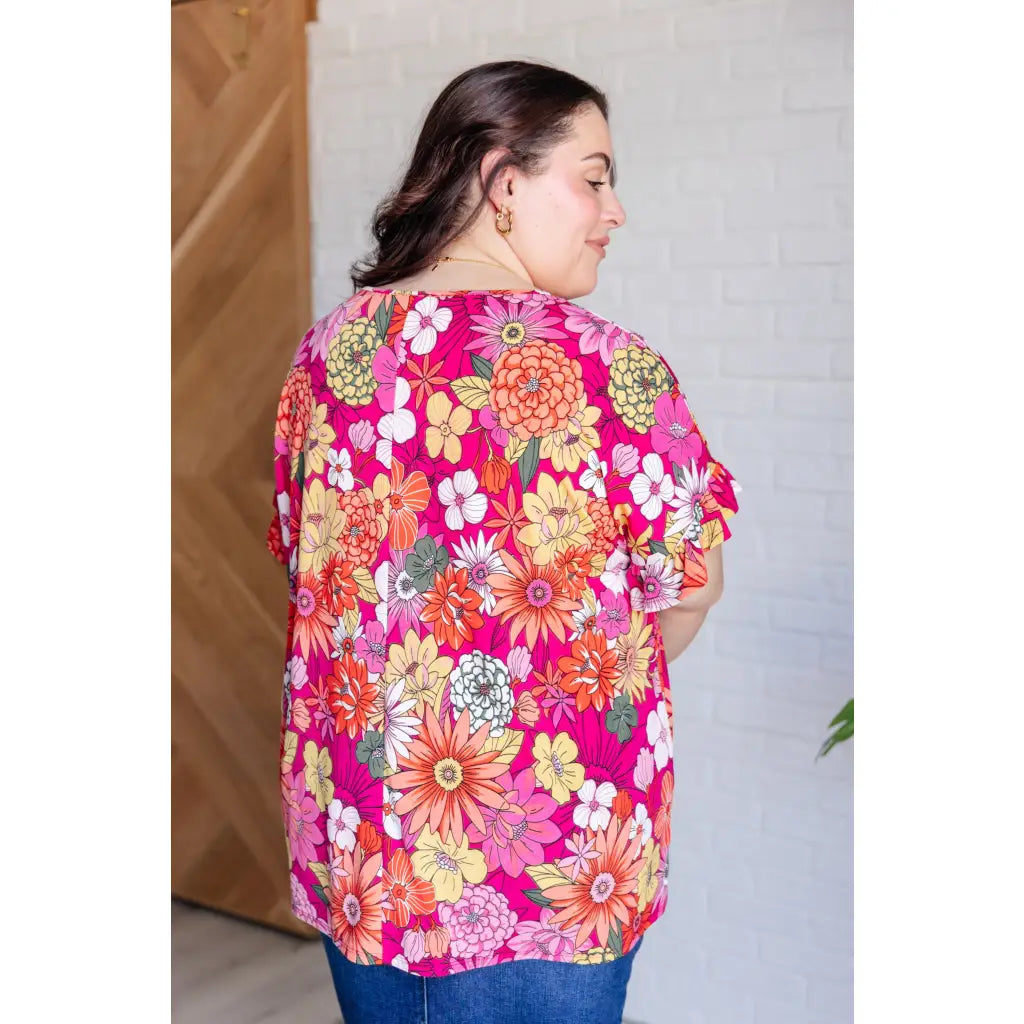 Floral Bulgari knit top with flutter sleeves and a gathered bust. Wrinkle-resistant available in plus sizes up to 3XL