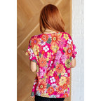 Floral Bulgari knit top with flutter sleeves and a gathered bust. Wrinkle-resistant available in plus sizes up to 3XL