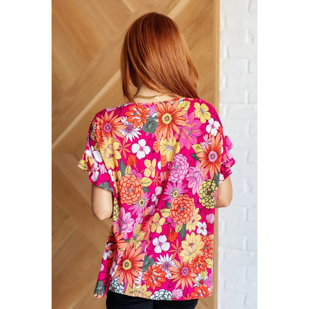 Floral Bulgari knit top with flutter sleeves and a gathered bust. Wrinkle-resistant available in plus sizes up to 3XL