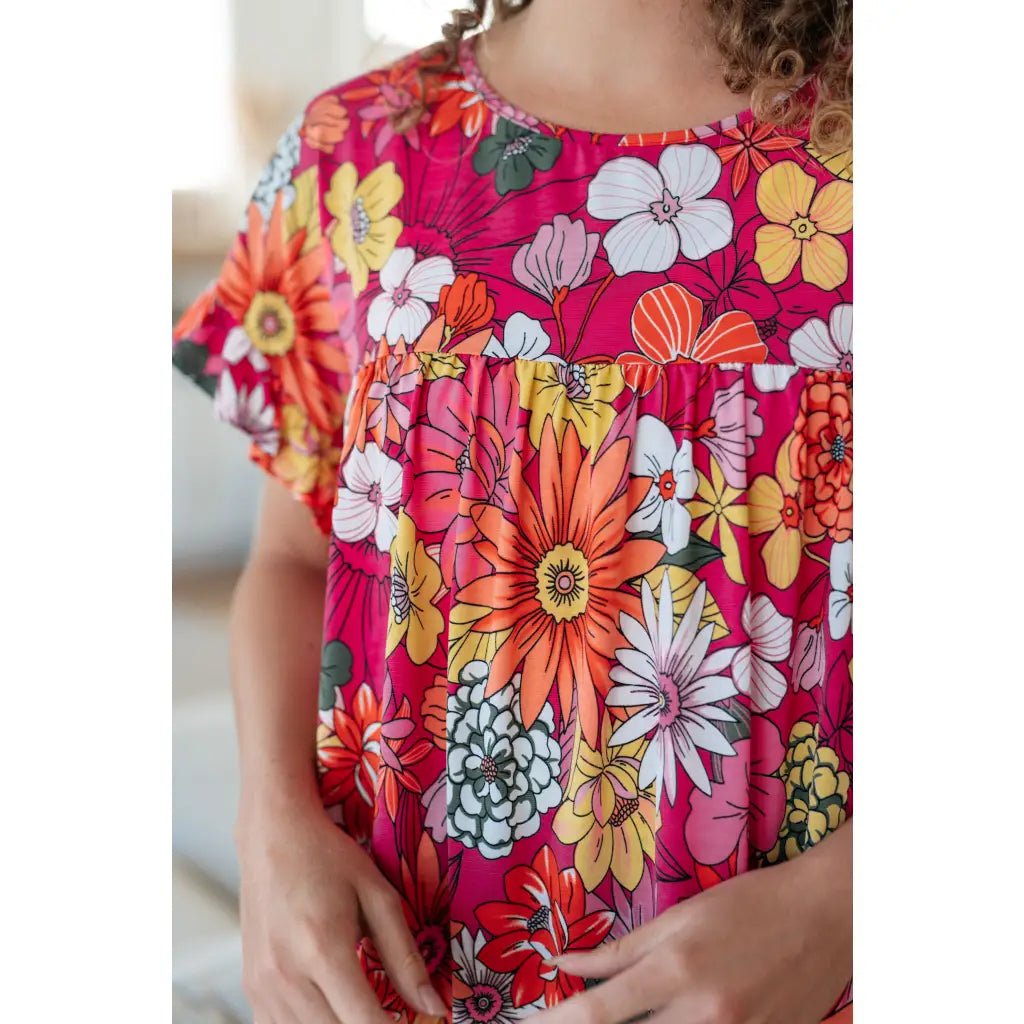Floral Bulgari knit top with flutter sleeves and a gathered bust. Wrinkle-resistant available in plus sizes up to 3XL