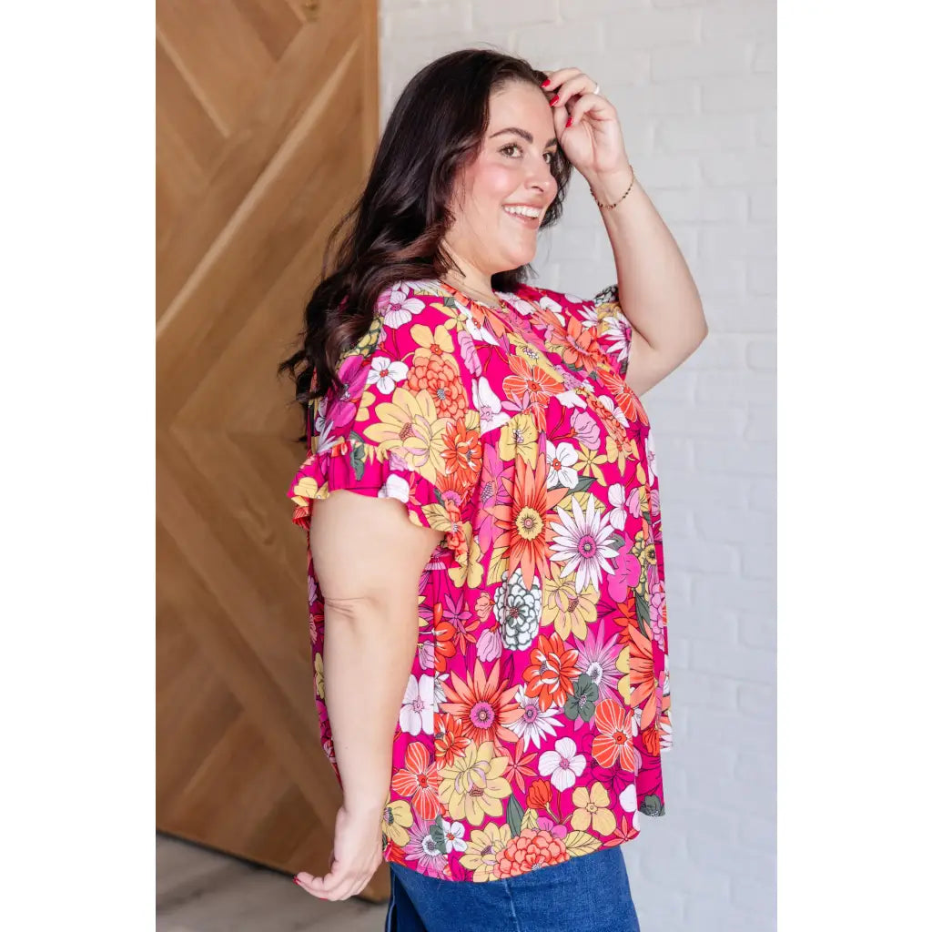 Floral Bulgari knit top with flutter sleeves and a gathered bust. Wrinkle-resistant available in plus sizes up to 3XL