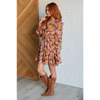 Our Boho Floral Balloon Sleeve Mini Dress is constructed in a playful chiffon material featuring v-neck ront buttons
