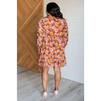 Our Boho Floral Balloon Sleeve Mini Dress is constructed in a playful chiffon material featuring v-neck ront buttons