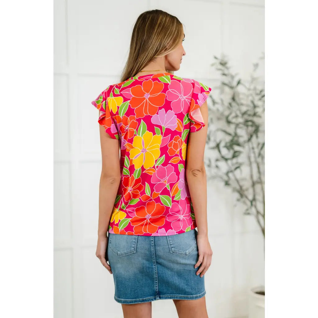 The Bold in Bloom plus size top features soft knit fabric flutter sleeves and a floral print that flatters. Sweet comfy