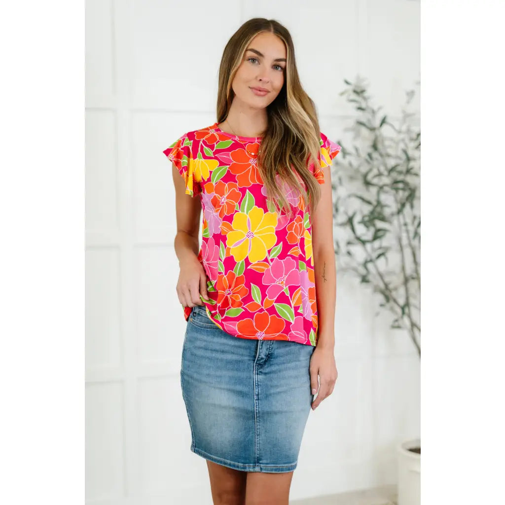 The Bold in Bloom plus size top features soft knit fabric flutter sleeves and a floral print that flatters. Sweet comfy