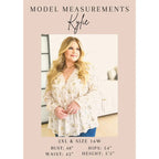 A bold flowy pink blouse with chic dolman sleeves and an oversized fit — plus it’s designed to flatter all sizes