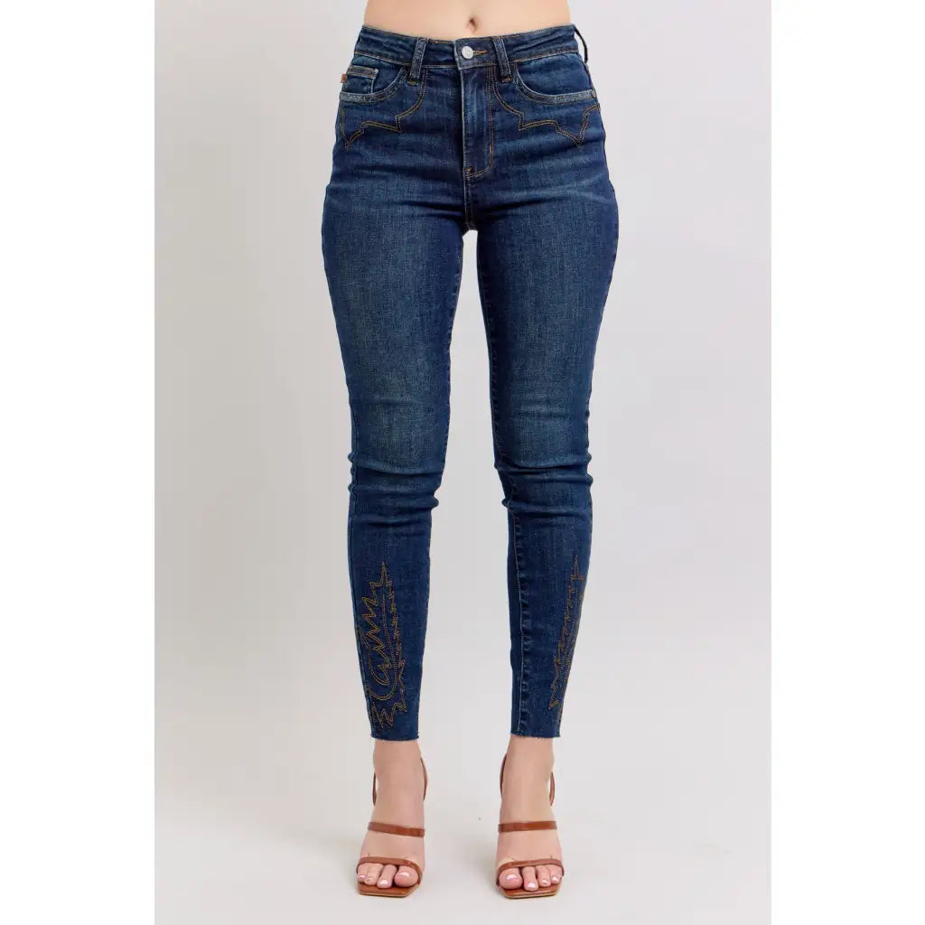 Dark wash Skinny Judy Blue jeans with boot stitch embroidery and high rise fit—chic comfy made to flatter every shape.