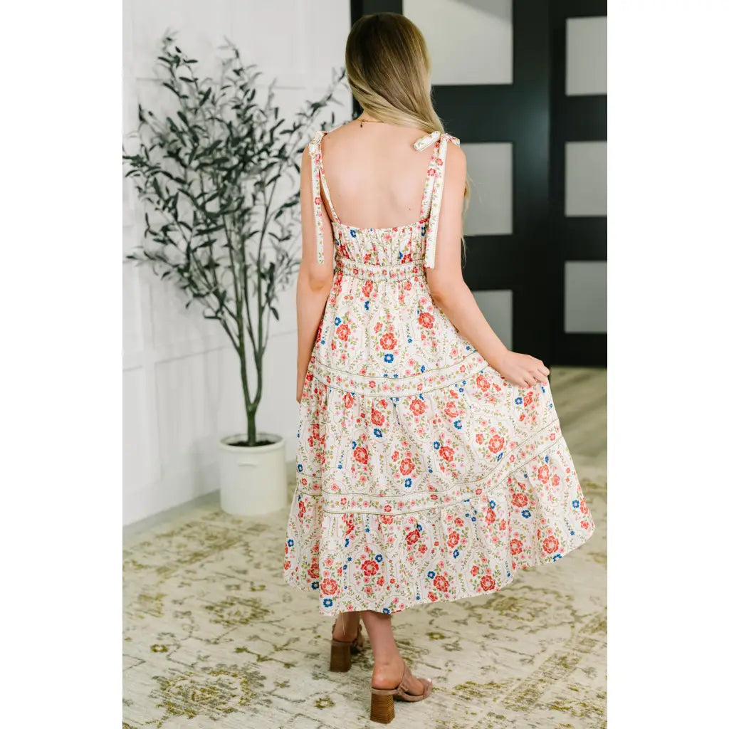 Romantic floral tiered midi dress with adjustable straps in cream. Available plus sizes. Lightweight breezy and perfect