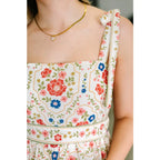Romantic floral tiered midi dress with adjustable straps in cream. Available plus sizes. Lightweight breezy and perfect