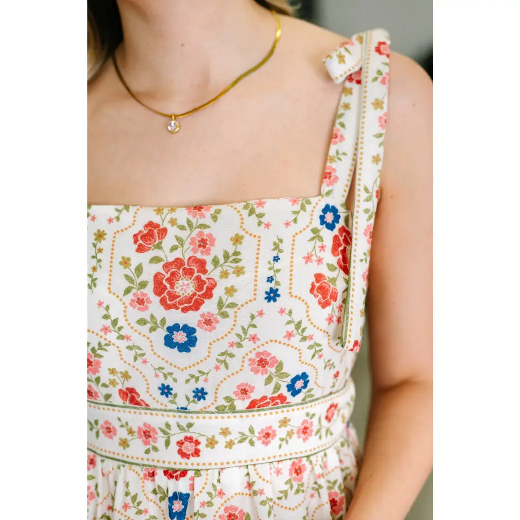 Romantic floral tiered midi dress with adjustable straps in cream. Available plus sizes. Lightweight breezy and perfect