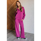 Stay stylish on the go with our Boujee Basic Travel Zip Pullover in Magenta. Wrinkle-resistant cozy and available plus