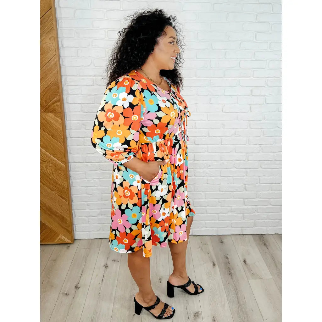 Make a statement in the Bow-dly Go V-Neck Floral Mini Dress. A bold playful vibrant boutique dress buttery soft fabric