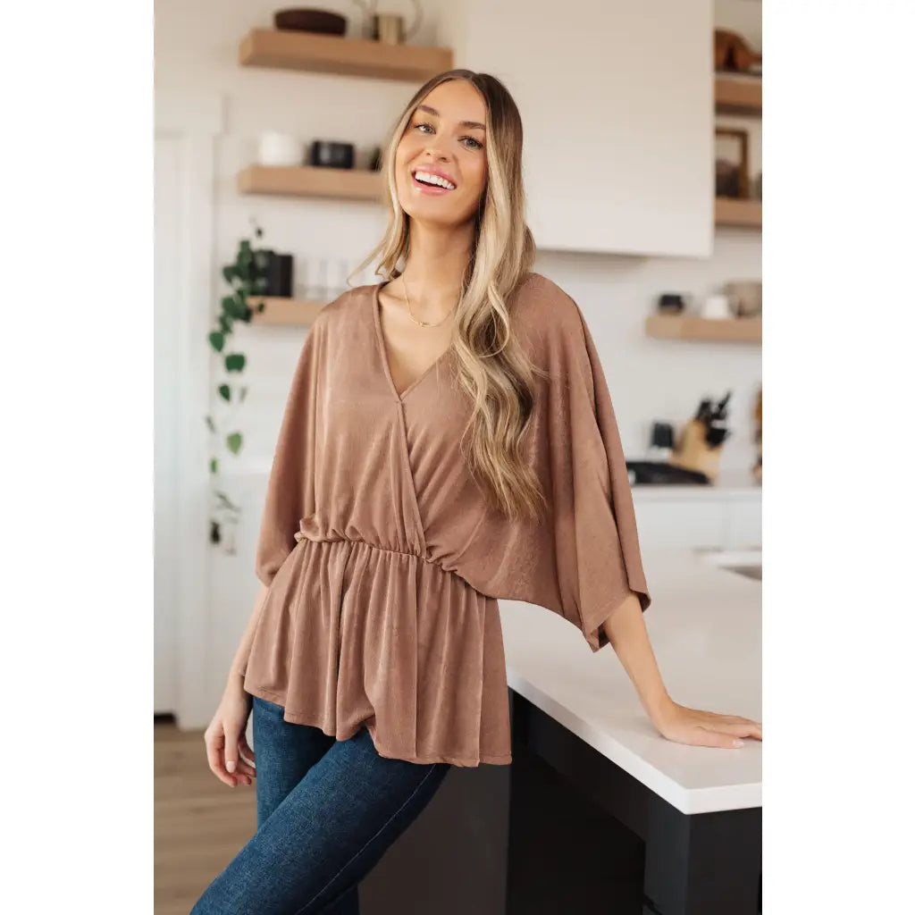 Meet our Bronzed Daze Draped V Neck Blouse! This gorgeous top is constructed from a slinky and shimmering bronze ribbed